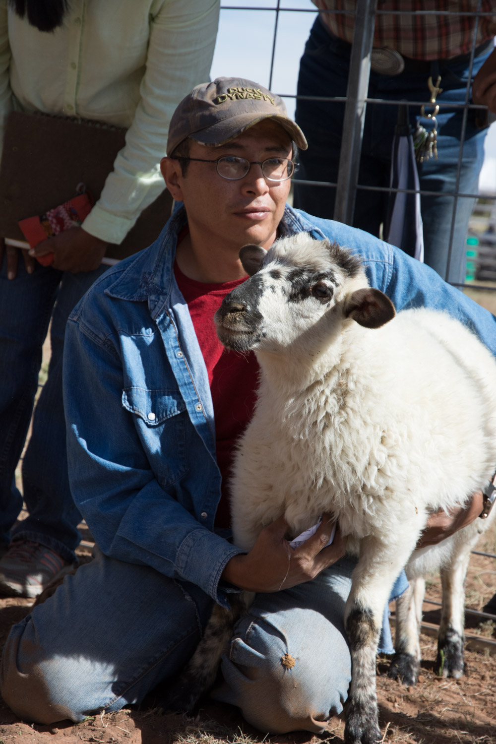 A Navajo sheep herder with one of his Navajo Churro sheep.