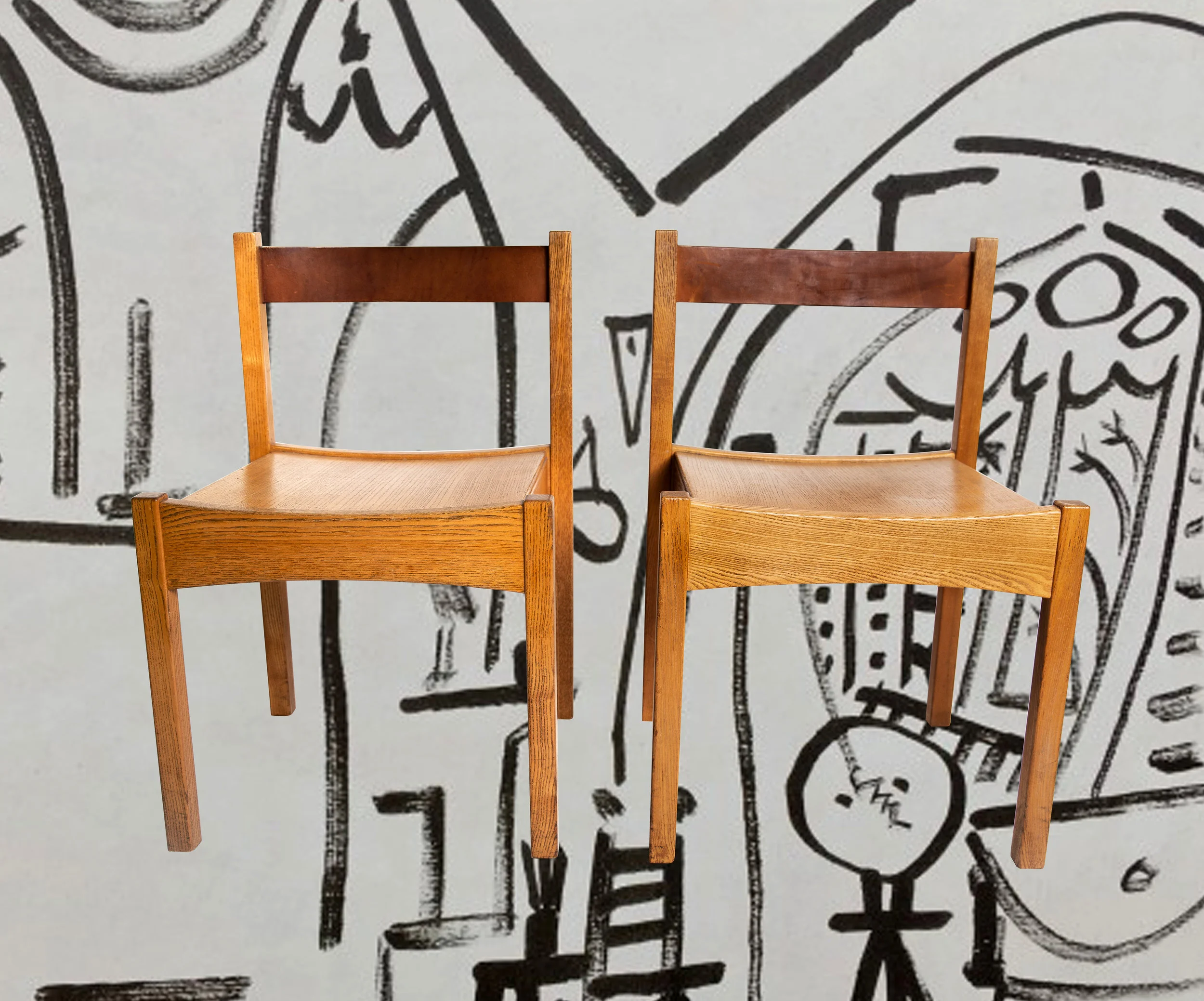 A PAIR OF LEATHER BACKED GEOMETRIC STUDIO CHAIRS