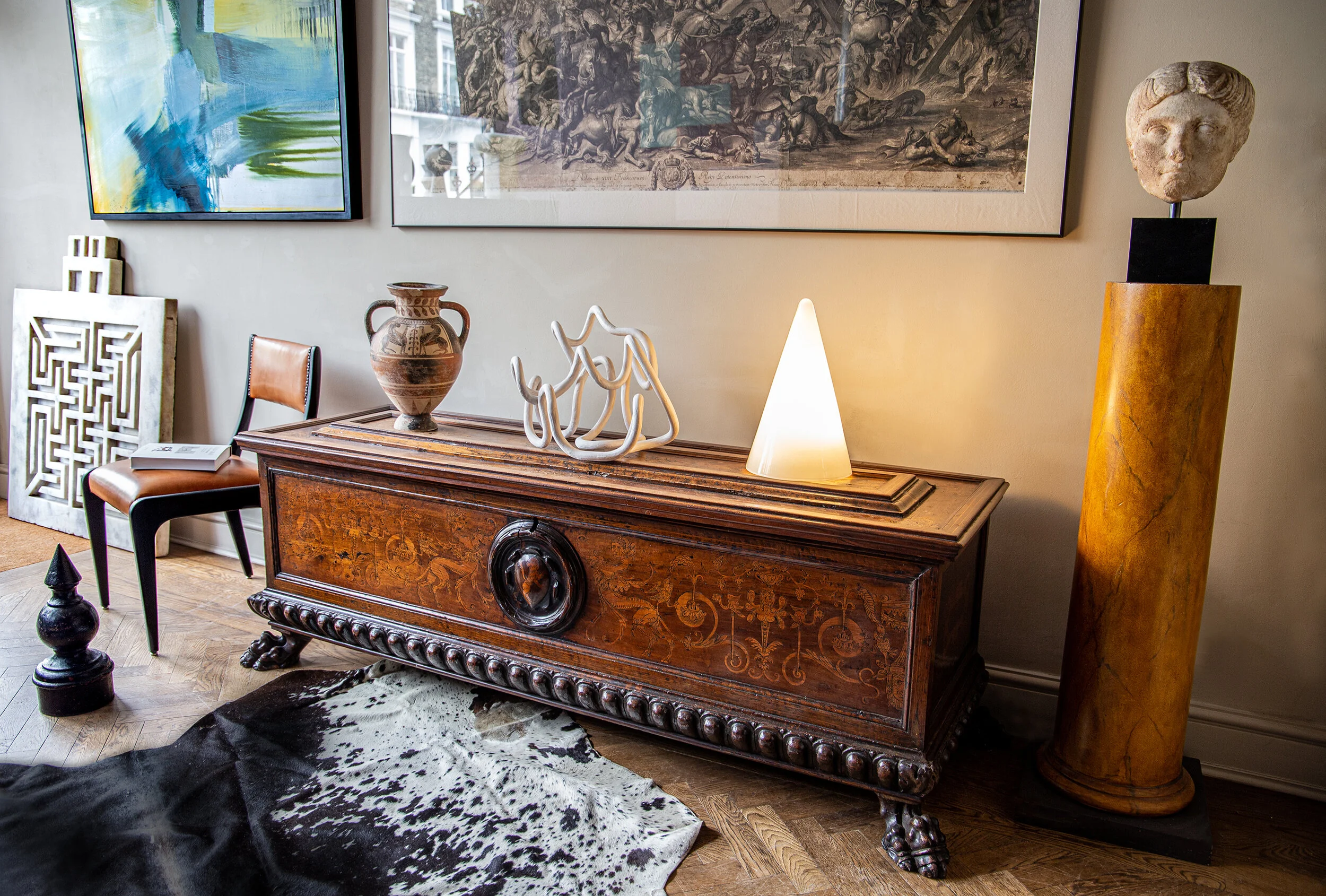 AN EARLY BAROQUE WALNUT CASSONE INLAID WITH ENGRAVED FRUITWOOD MARQUETRY