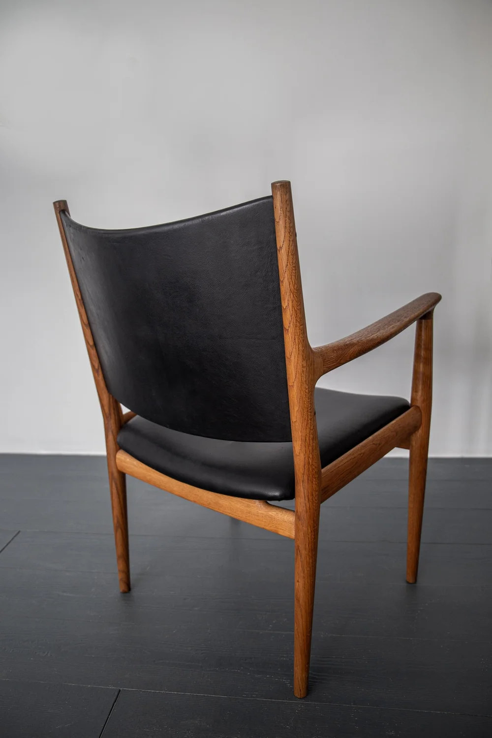 A SET OF FOUR JH513 ARMCHAIRS IN OAK BY HANS WEGNER FOR JOHANNES 