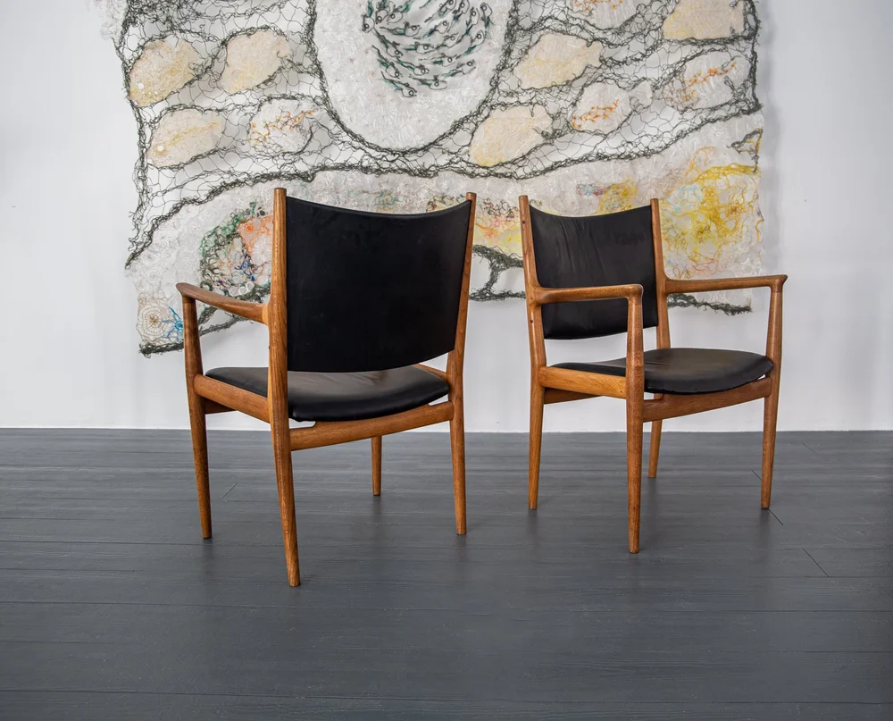 A SET OF FOUR JH513 ARMCHAIRS IN OAK BY HANS WEGNER FOR JOHANNES 