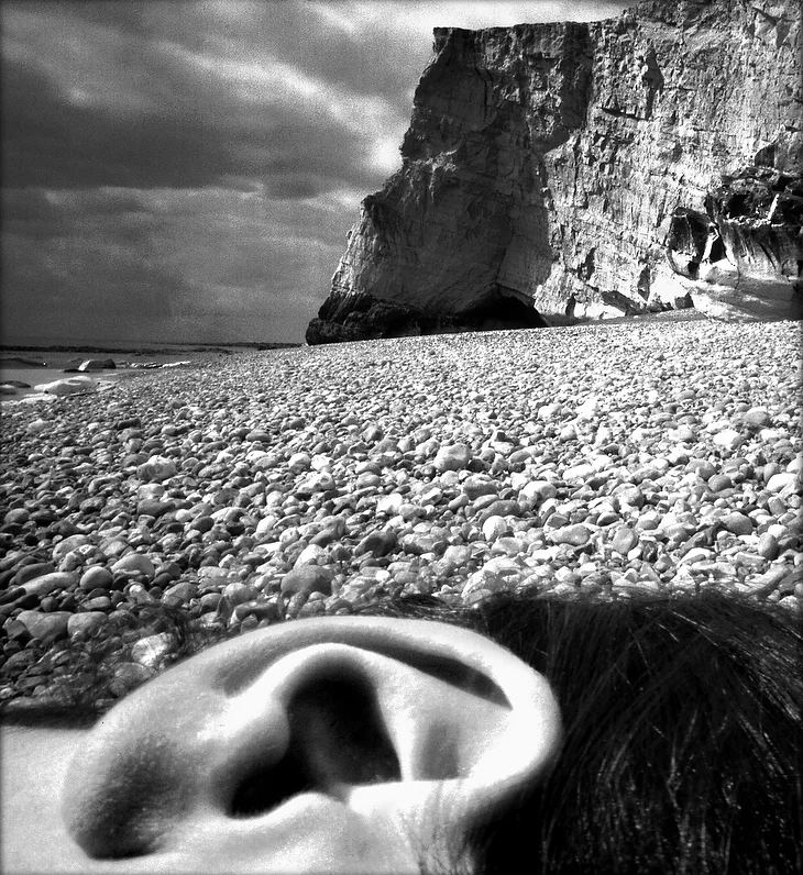 38-Nude__East_Sussex_1957__ear_on_beach_.jpg