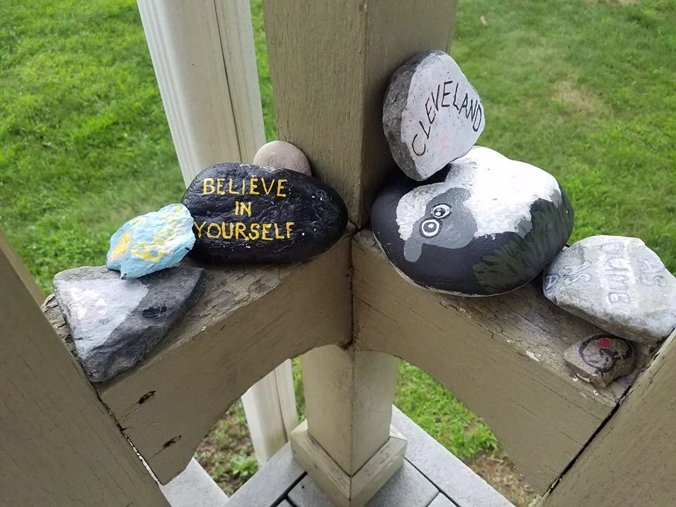 Photo courtesy of D. Santucci. Painted rocks collected from trails and mountain tops line this hiker’s porch.