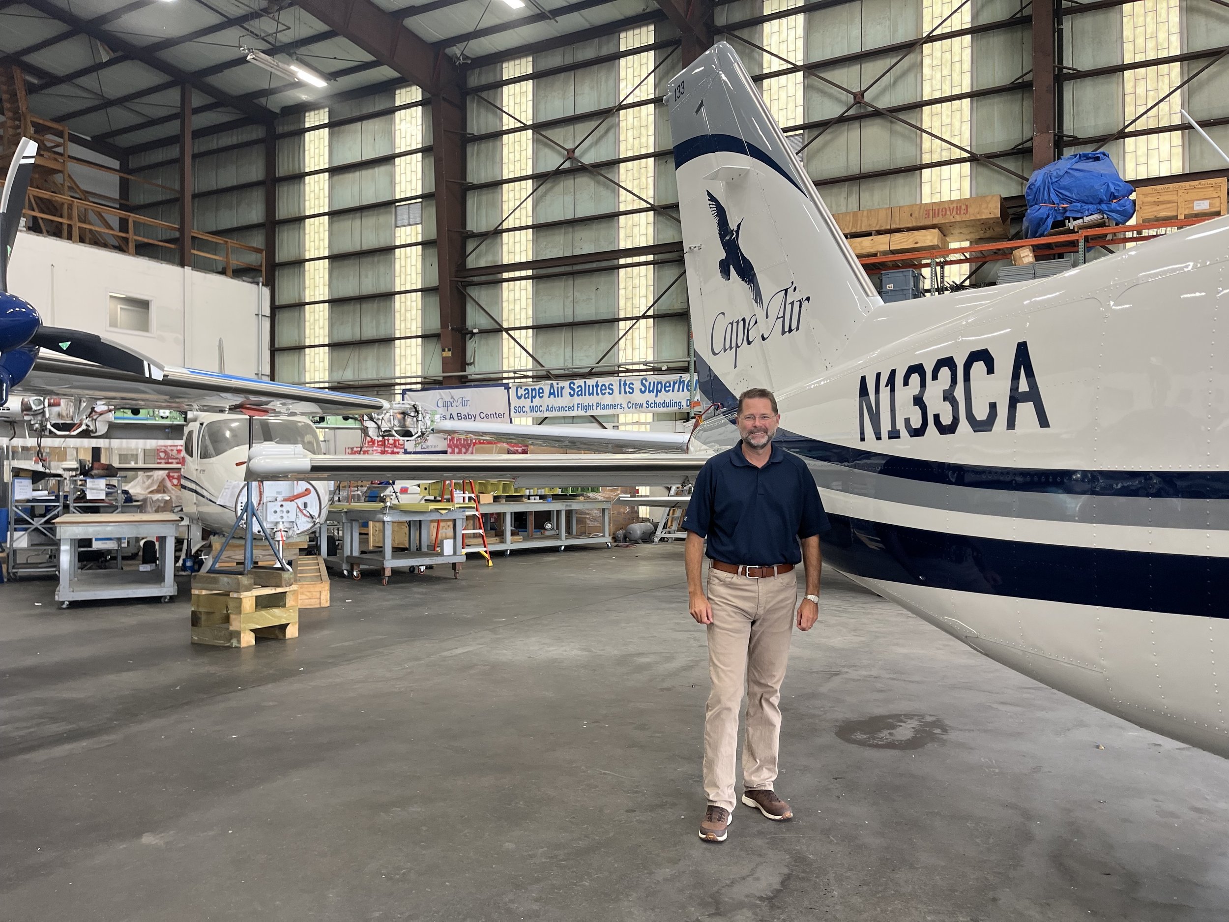  Jim Goddard, senior VP of fleet planning and technical operations for Cape Air, poses in front of a Cessna 402. Photo by Justine Paradis. 