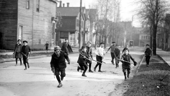  Children played in the streets, and were often struck by cars. Above, boys play "shinny," a form of street hockey, on a Detroit street, circa 1910. (The Detroit News Archives) 