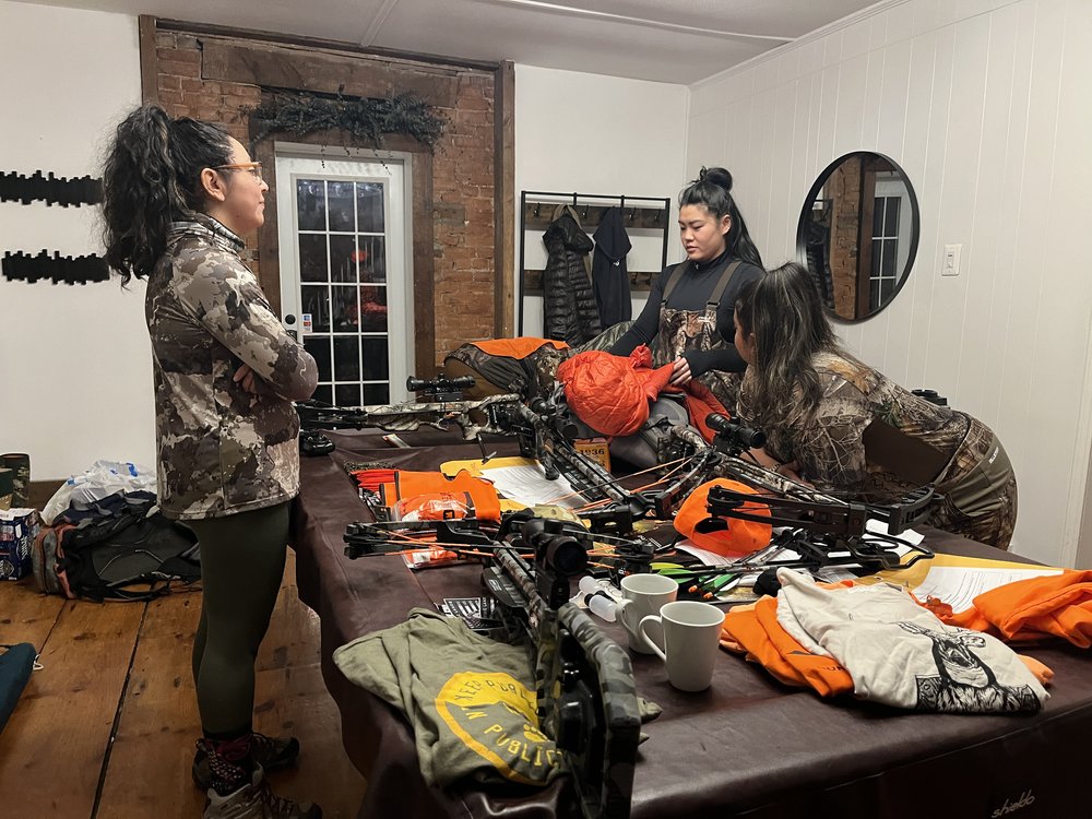  Tracey, Dorothy, and Eliza get ready to hunt in the early morning. (Photo Credit: Felix Poon) 