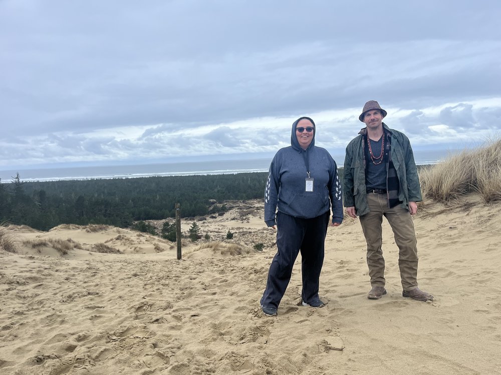  Patty Whereat Phillips (left), author and language teacher for the Confederated Tribes of the Coos, Lower Umpqua, and Siuslaw Indians (CTCLUSI). At right, Jesse Beers, CTCLUSI cultural stewardship manager.  Photo by Justine Paradis. 