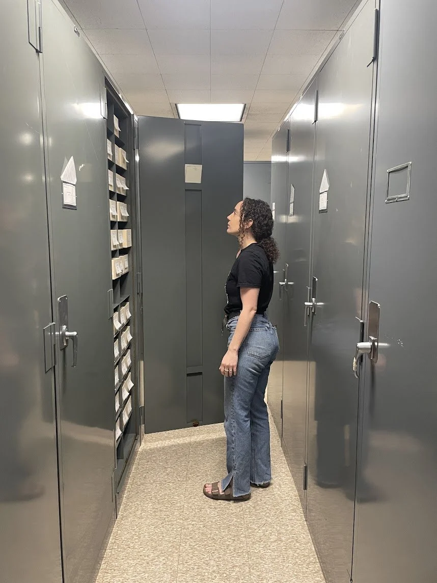 Patty Kaishian opens up one of the many metal cabinets within the mycological collection, on the hunt for a polypore. Photo by Marina Henke.
