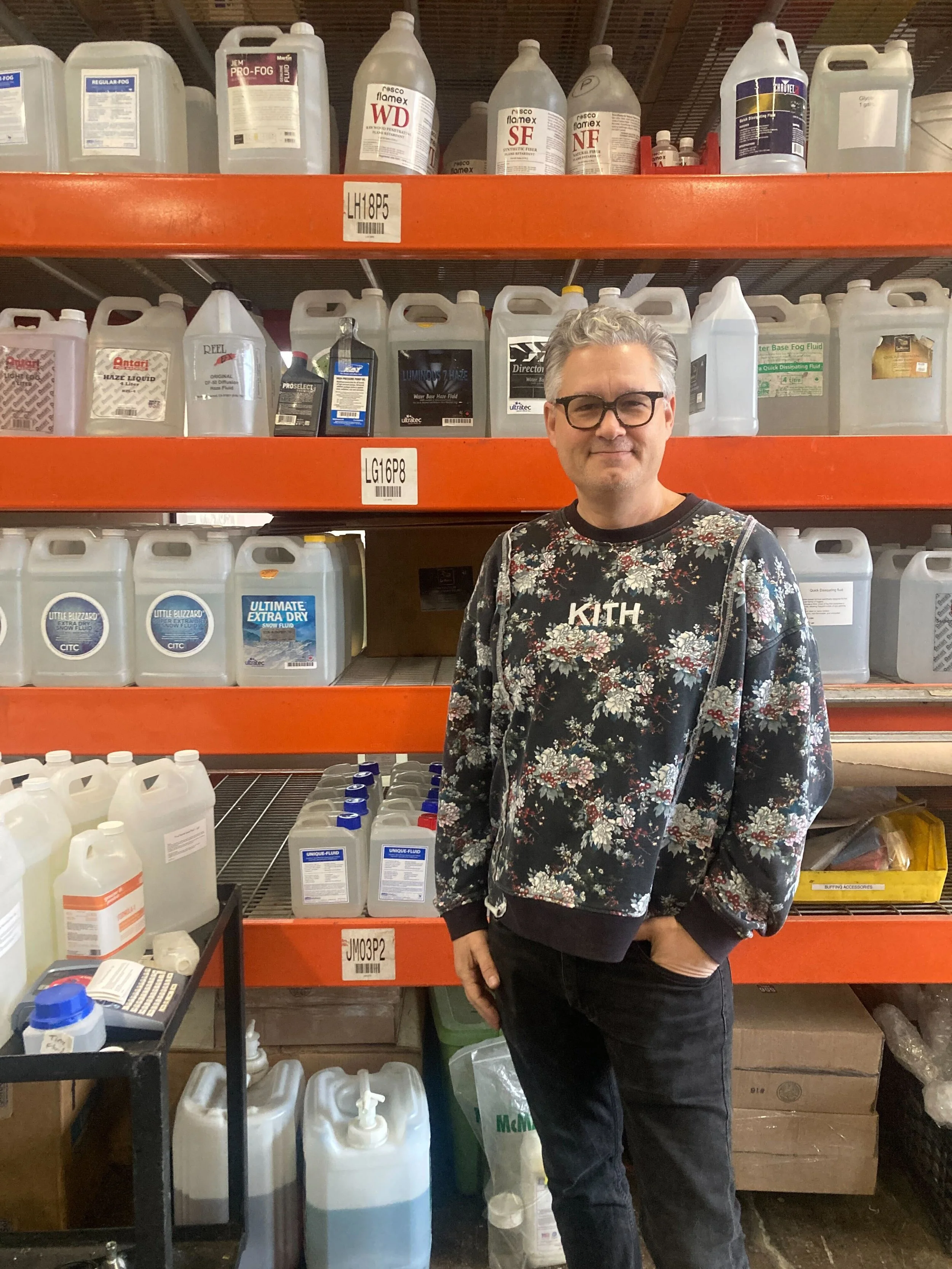  Jeremy Chernick, co-owner at J&amp;M Special Effects stands in front of the many liquids that aid in creating staged weather.  