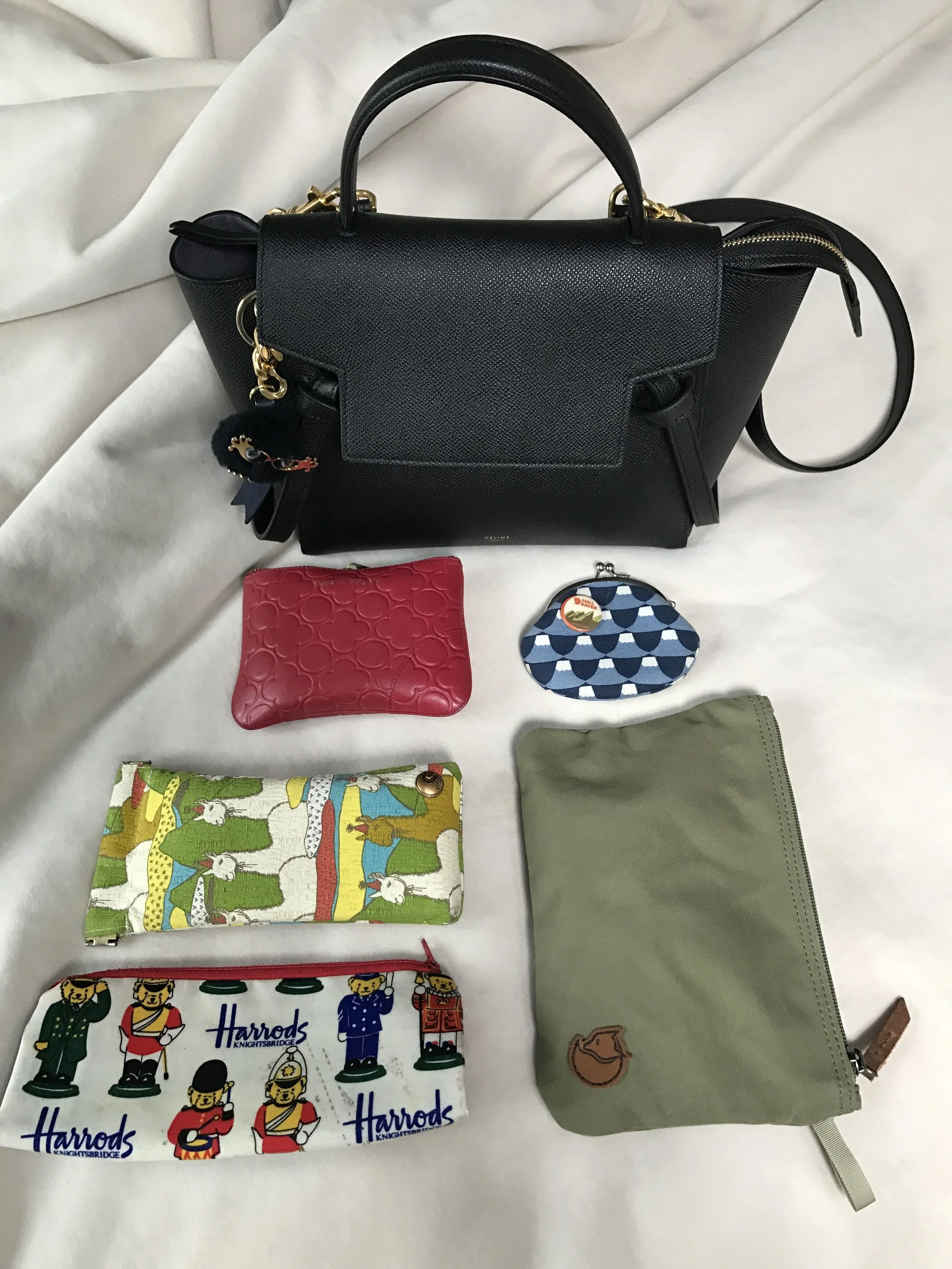 My usual daily items in my bag (wallet, coin purse, sunglasses, and several pouches for essentials)