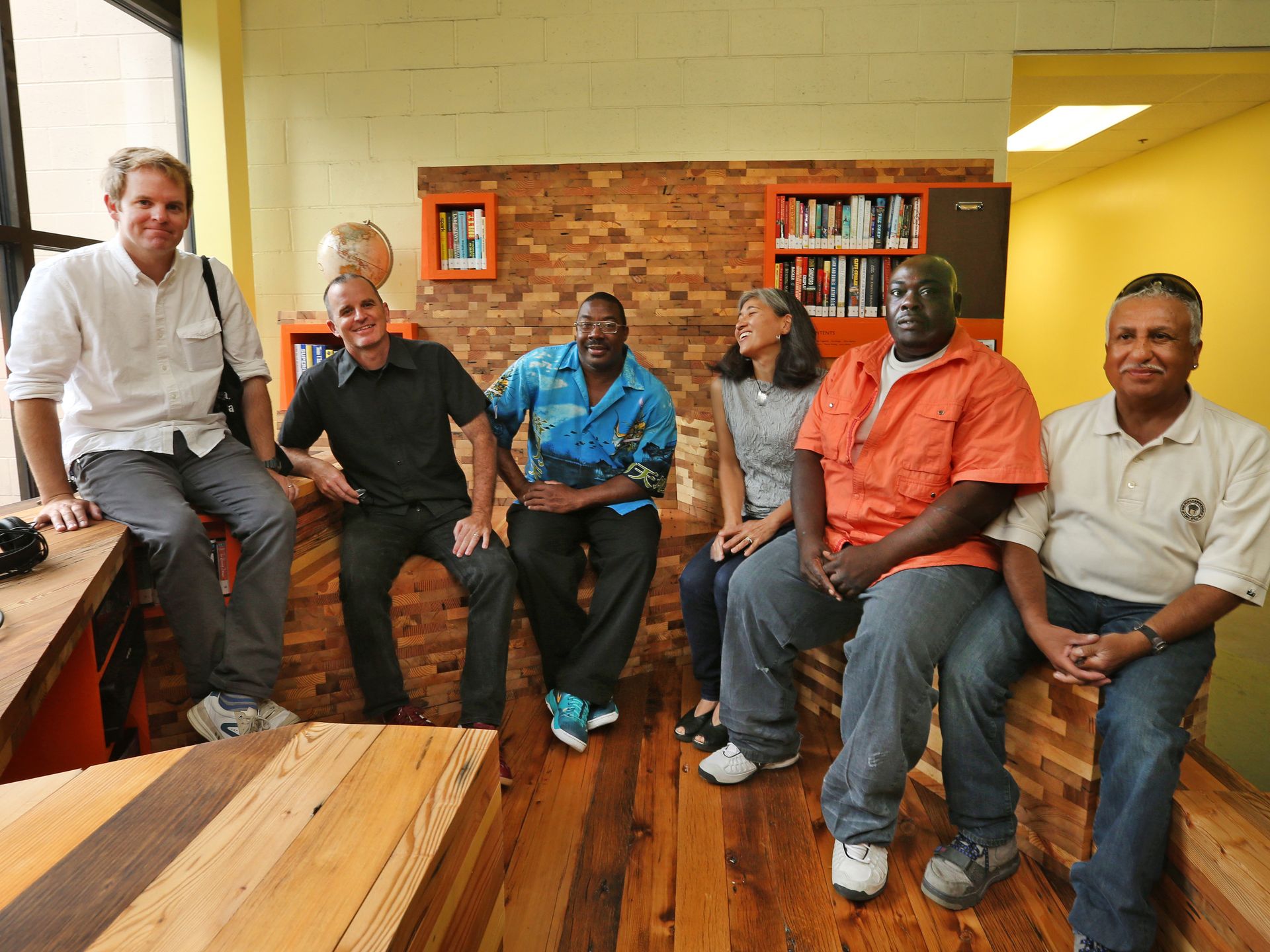 Table of Contents provides our most vulnerable neighbors with comfortable and inviting pavilions for reading and listening to audio books. The project was conceived and designed in direct collaboration with the “neighbors” of Horizon House who are experiencing homelessness. The structures were fabricated off site but were assembled and finished on site with the help of the Horizon House community, providing temporary employment to a group of neighbors. Photo by Charlie Nye for the Indianapolis Star. Artist Stuart Hyatt and architects Josh Coggeshall and Janice Shimizu (S+Ca) sit with some of the "neighbors" that were hired to build their project. 
