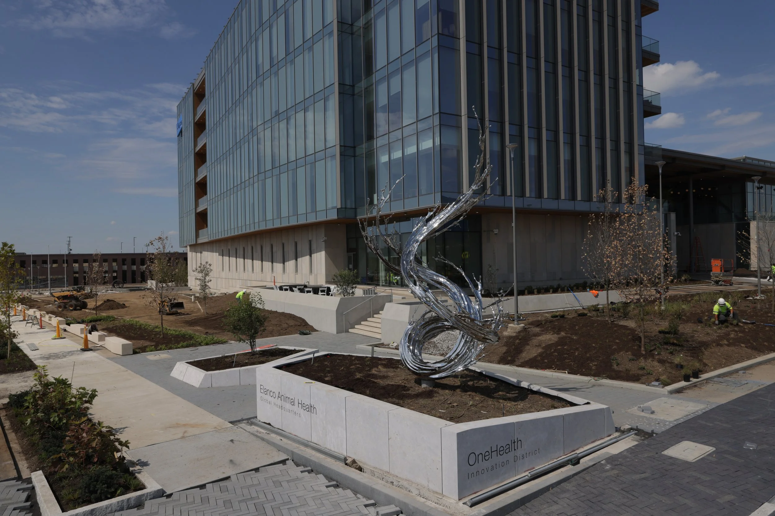  Art Strategies collaborated with our corporate partner, Elanco Animal Health, to select an artwork that honors and represents its new global headquarters and the gateway to the One Health District along the White River.     Water in Dripping, River 