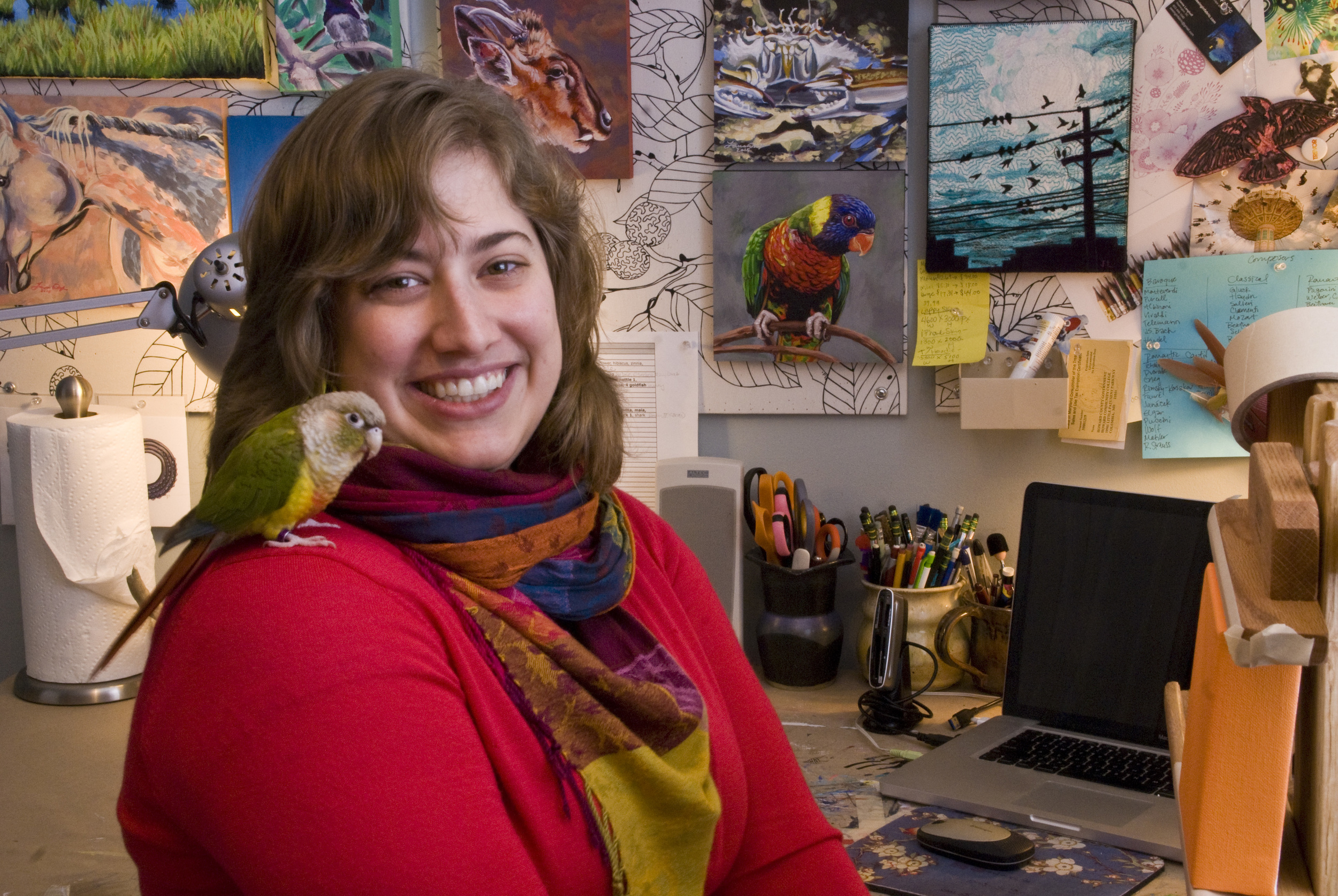 In my studio with my green cheek conure, Pippa.