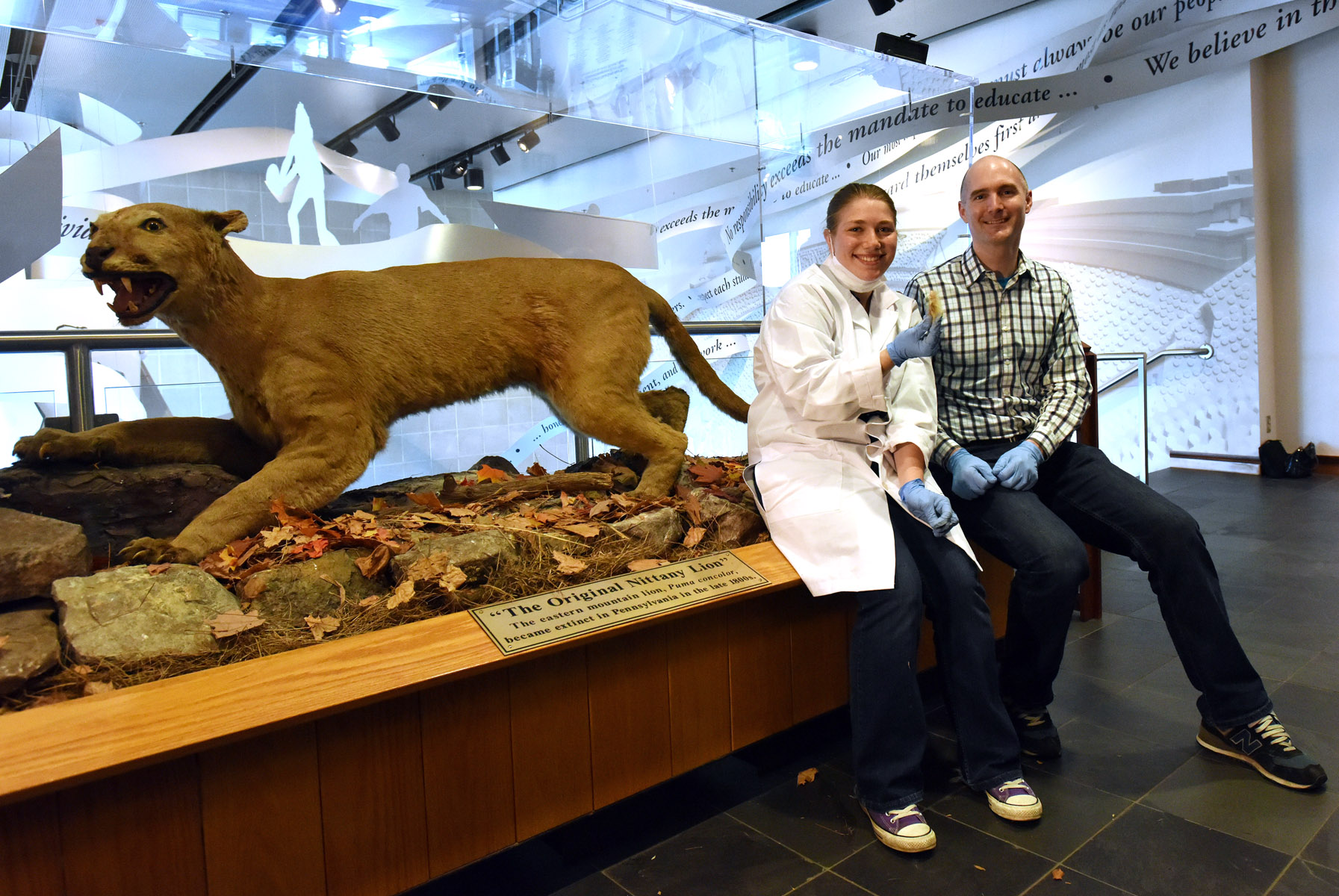  Undergraduate student Maya Evanitsky with Dr. Perry after Maya sampled&nbsp;"The Original Nittany Lion" at the Penn State All Sports Museum&nbsp;for her ancient DNA study. Photograph: Pat Little, PSU. 