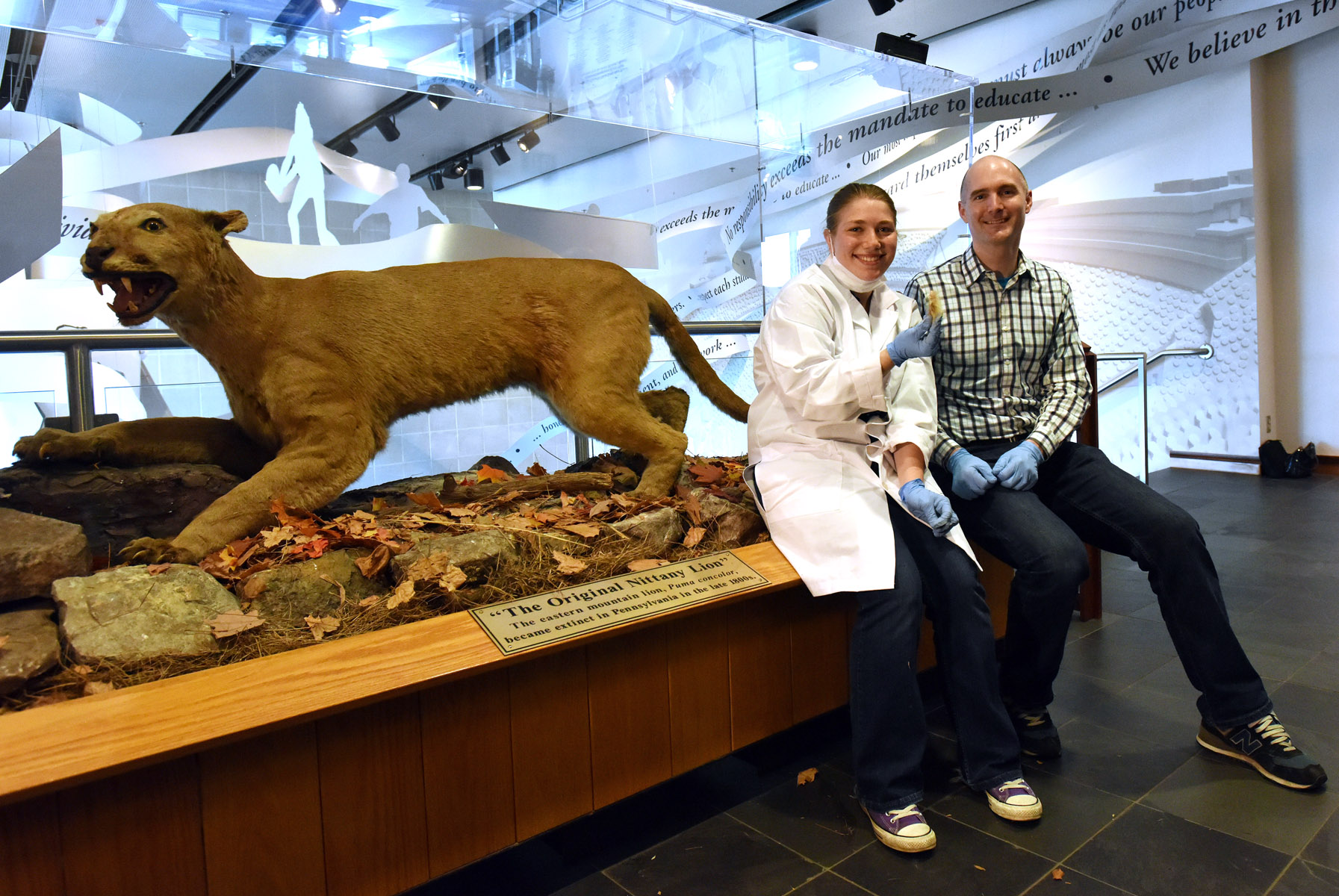 Undergraduate student Maya Evanitsky, who led the first phase of the Nittany Lion Genome Project, with Dr. Perry and one of the sampled Nittany Lions.