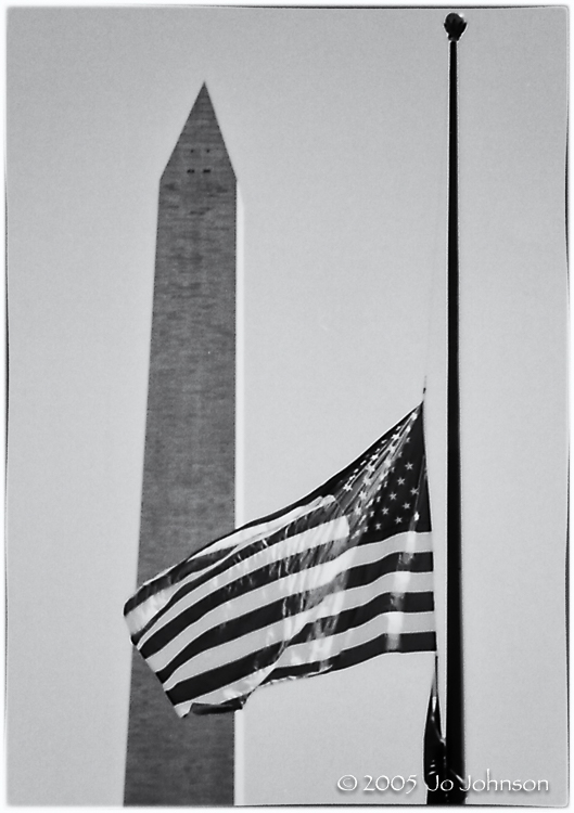 WWII Memorial Washington DC. The flag flies at half staff for Chief Justice William Rehnquist.