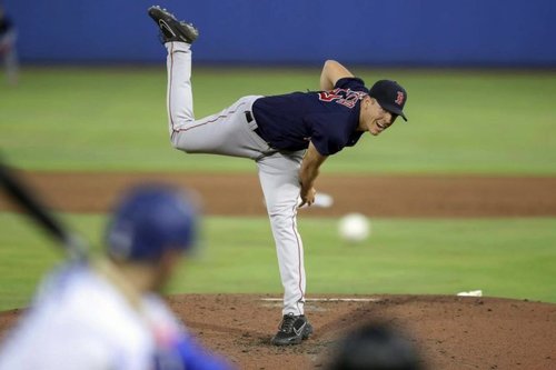 Ashli Bellinger threw the first pitch to her brother Cody on his