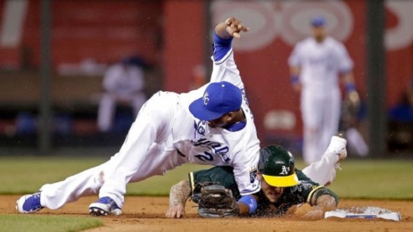 Oakland A’s 3B Brett Lawrie (Langley, BC) slid hard into Kansas City Royals SS Alcides Escobar on Friday. It wasn’t any more aggresive than the way Royals greats George Brett or Hal McRae used to break up double plays. The Royals took exception and Lawrie was plunked Saturday. Photo: Charlie Riedel.