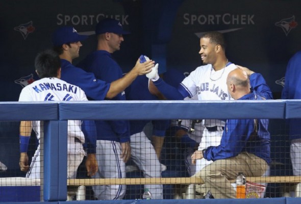 Dalton Pompey, Oakville Royals grad, is congratulated in the dugout after hitting his first homer … and he he hit off former Cy Young award winner Felix Hernandez of the Seattle Mariners.
