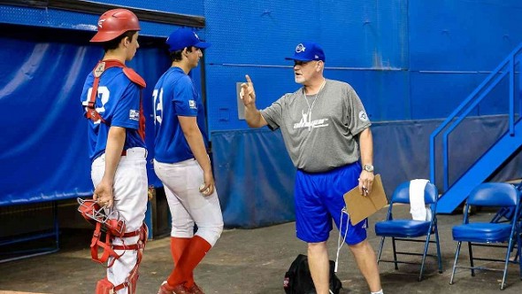 Former Blue Jays closer Duane Ward gives some instructions to a pair readying to leave the Rogers Centre bullpen at tryouts for the third annual Tournament 12 which features the best high schoolers from across Canada. Photo: Michele Prata. 