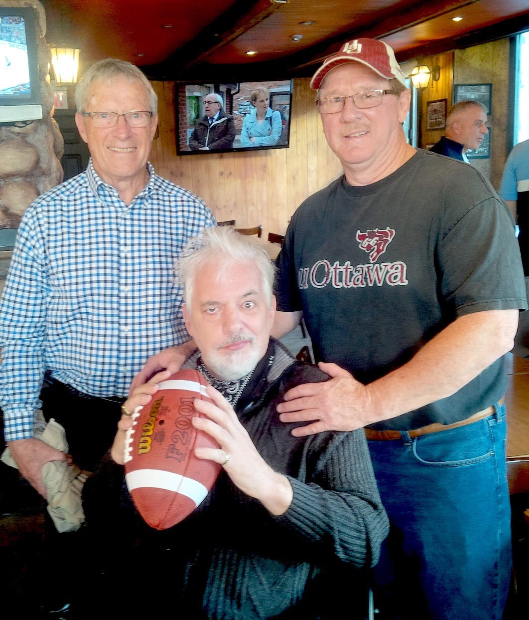 * Yves Leclerc, middle, saved the day for the University of Ottawa Gee-Gees in the 1975 Vanier Cup to save an undefeated season. Now, Leclerc flanked by receivers coach Bob Swann and wide receiver Duncan Armstrong, faces an uphill battle ... and his former teammates have his back. ....