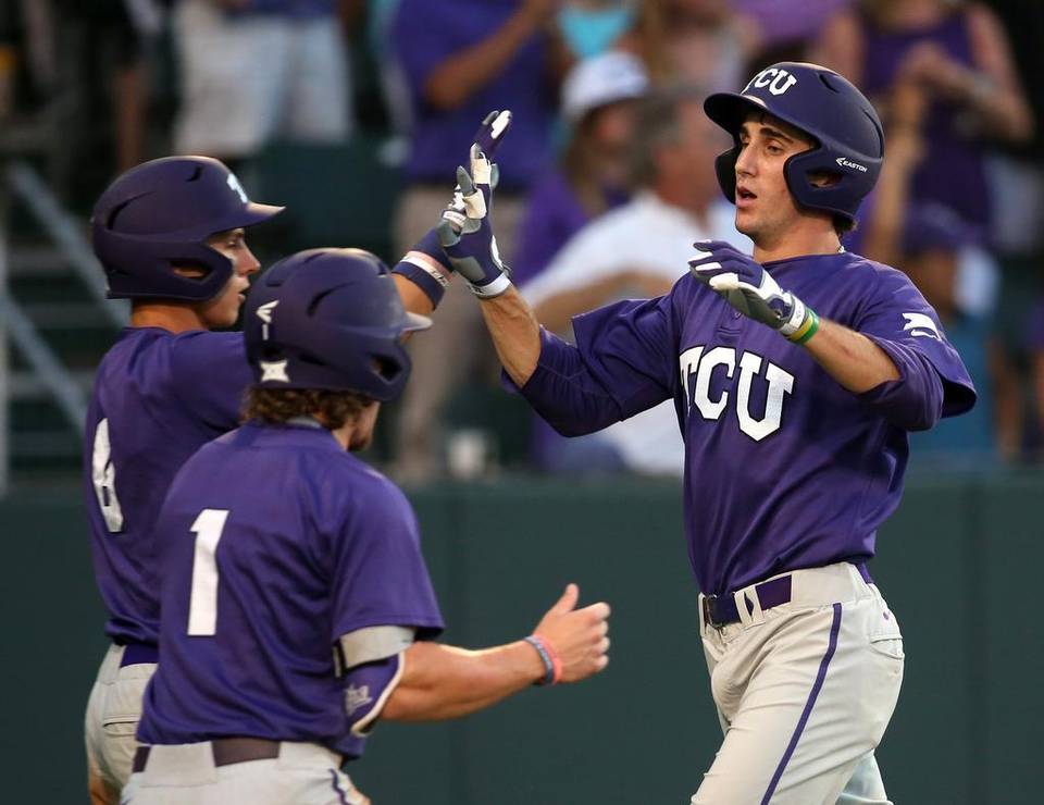 TCU’s Nolan Brown (6) and Cody Jones (1) celebrate with Jeremie Fagnan (32). Photo Richard W. Rodriguez.