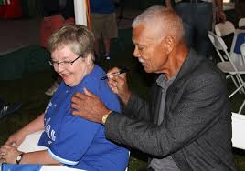 Former Montreal Expos manager Felipe Alou signing autographs after being inducted into the Canadian Baseball Hall of Fame in St. Marys.