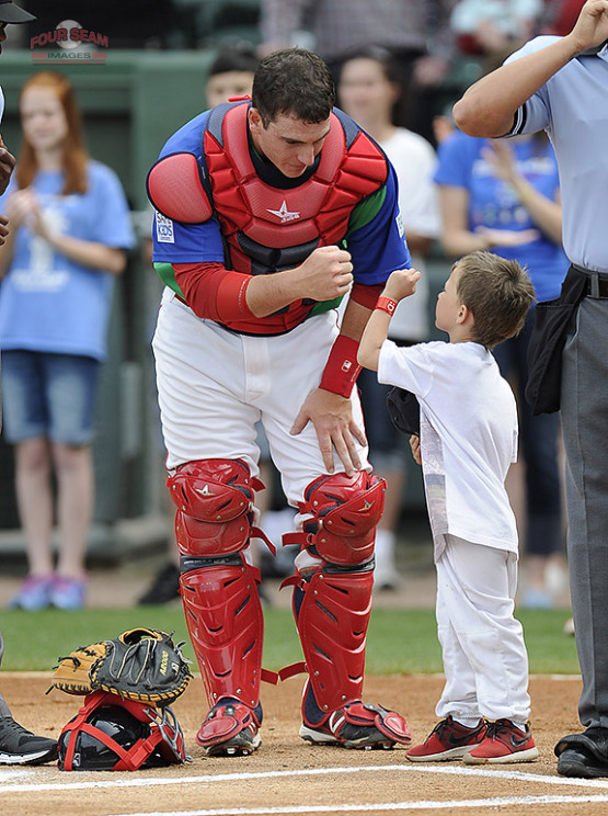 C Jordan Procyshen (Oktoks, Alta.) of the Greenville Drive wishes a fan good luck before a game against the Augusta GreenJackets at Fluor Field at the West End in Greenville, SC. Procyshen was promoted to class-A Salem. (Tom Priddy/Four Seam Images)