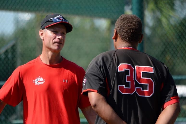 Greg Hamilton, left, of Baseball Canada checks with Josh Naylor (Mississauga, Ont.) selected 12th over all in the June draft. Photo: Alexis Brudnicki.