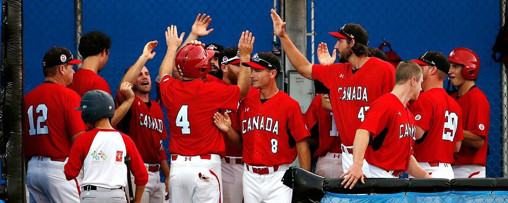 Greg Hamilton, Baseball Canada`s director of national teams, is the man behind the scenes recruiting players to wear the red and white. In this rare photo Hamilton (8) is in the forefront of the picture.