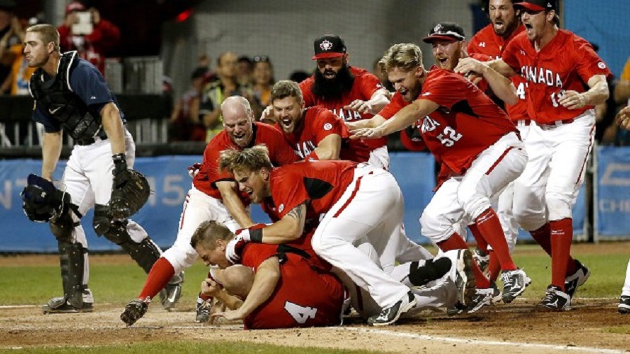 3B Peter Orr (4) is moved after scoring the winning run at President's Choice Field in Ajax and is mobbed by Tyler O;Neill, Jordan Lennerton and Skyler Stromsmoe in a strange, strange ending.