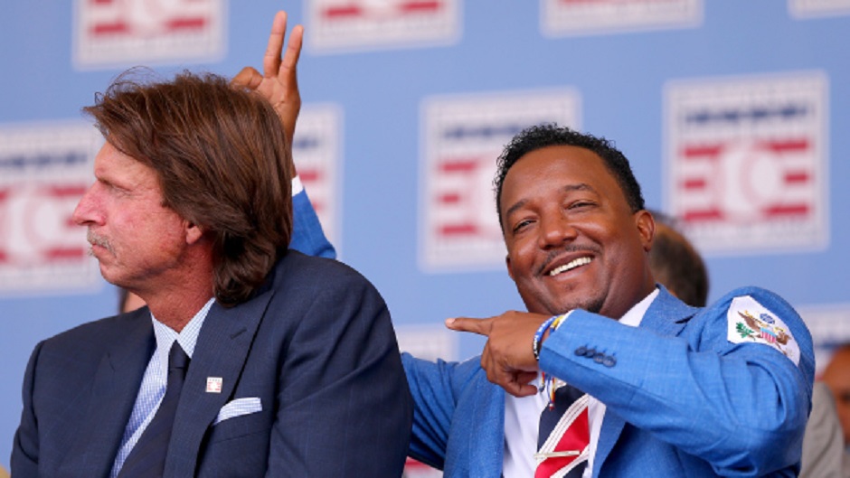 LHP Randy Johnson, left, and Pedro Martinez, hamming it up on induction day, spent the early part of their Hall of Fame careers with the Montreal Expos. 