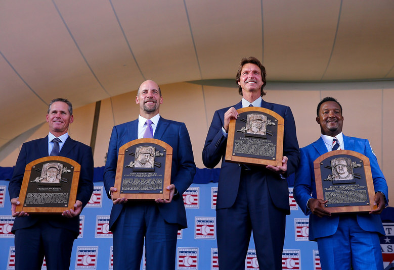 HOFers Craig Biggio (from left to right), John Smoltz, Randy Johnson and Pedro Martinez with their plaques.
