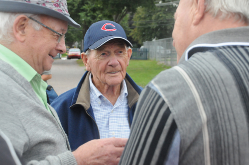 Hank Landry (centre) with former teammates Gerald Keough and George Dalton after the ceremony officially naming Legends Field in Summerside, PEI, in honour of Landry and other baseball stars. Photo: Brett Poirier/Journal Pioneer.