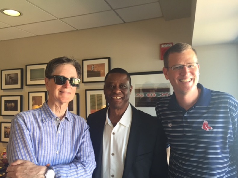 Boston Red Sox president John Henry, Warren Cromartie of the Montreal Baseball Project and Sam Kennedy, CEO of the Red Sox visit at Fenway Park. 