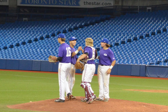 Prairies Purple players celebrate on the mound following an upset win over Ontario Green. Photo Credit: Leah Smith