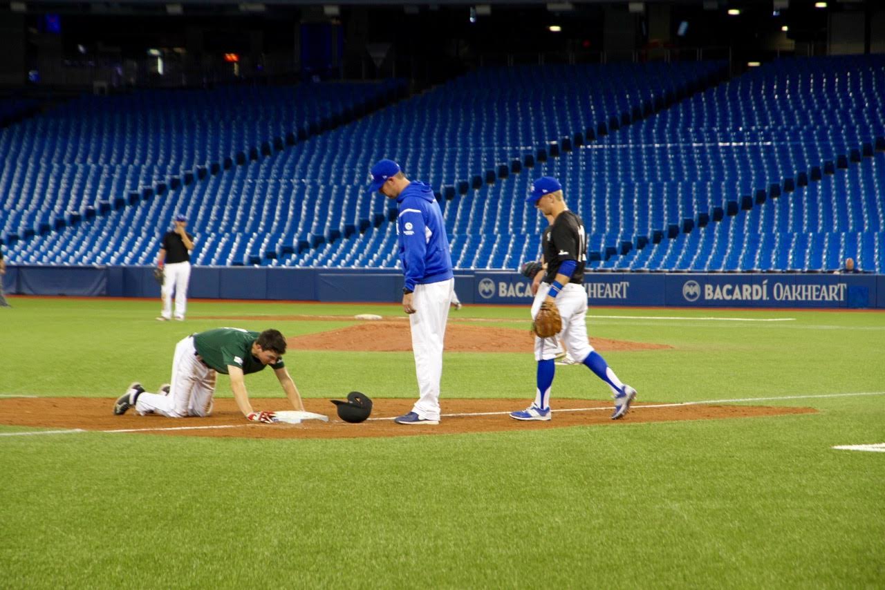 SS Taylor Hall (London, Ont.) arrives safely at third after a head-first slide. Photos: Tyler King.