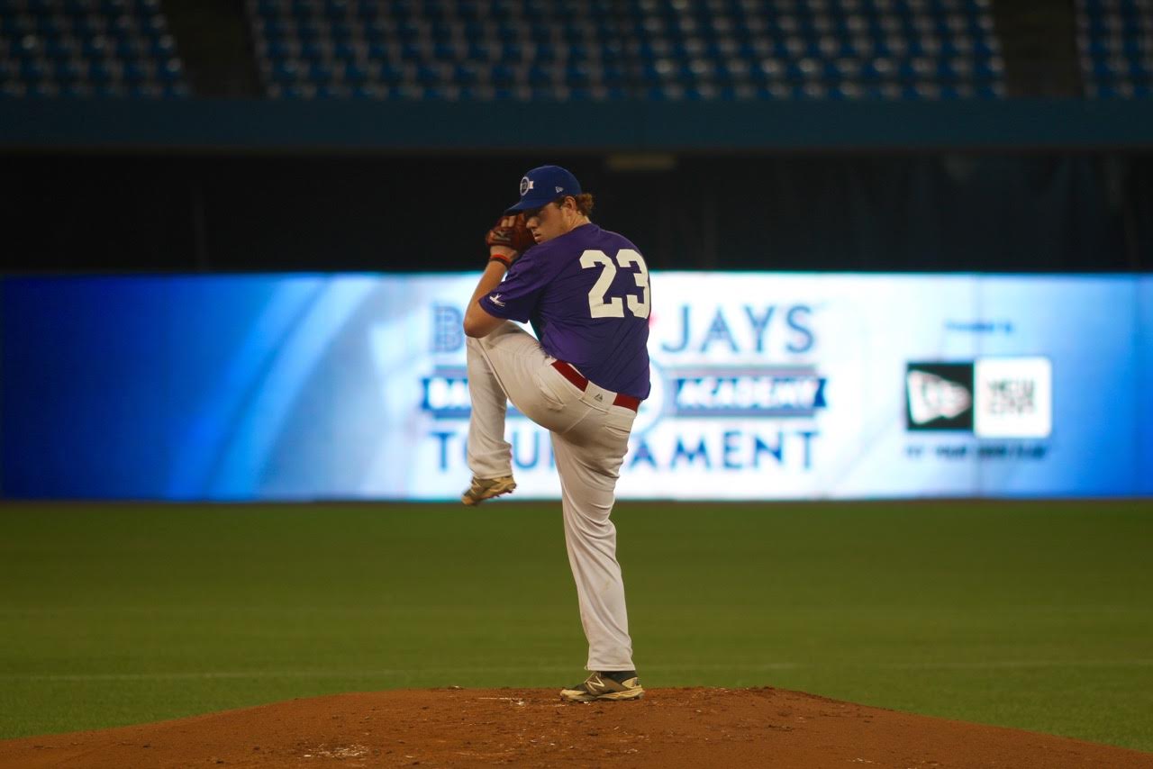 Prairies Purple's Zach Demchenko (Saskatoon, Sask.) of the Okotoks Dawgs, works in the Tournament 12 finals against Quebec Blue. (Tyler King/Canadian Baseball Network)