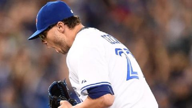 Lefty Brett Cecil leaves the mound after fanning Brian McCann for his third strikeout of the eighth inning while facing the tying run at the plate on Monday night.