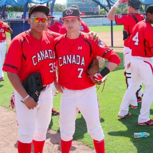 INF Peter Hutzal (Calgary, Alta.) right of the Okotoks Dawgs with Josh Naylor.