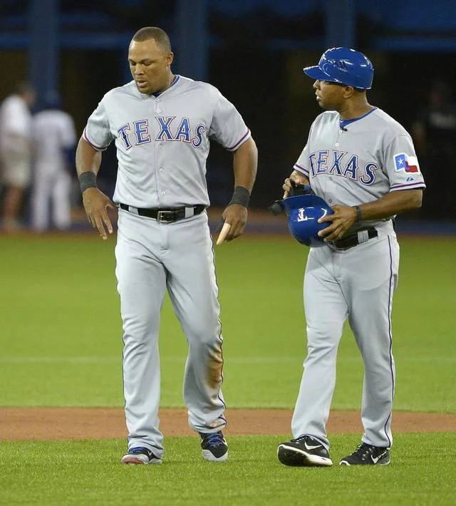 3B Adrian Beltre lifts off after a third-inning single. He injured his back two innings before breaking up two at second base.
