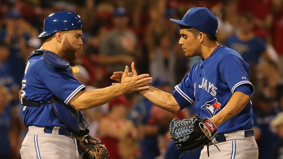 RP Roberto Osuna (right) shakes hands with C Russell Martin (Montreal, Que.) after a save. Photo: Getty Images.