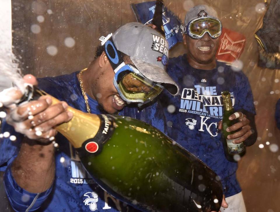 Kansas City Royals’ Edinson Volquez and Salvador Perez celebrate in the locker room after 4-3 win over the Toronto Blue Jays to advance to the World Series.