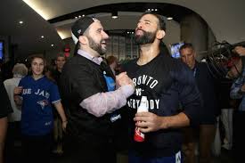 Former Blue Jays GM Alex Anthopoulos in happier times with slugger Jose Bautista.