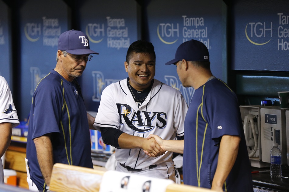 RHP Erasmo Ramirez (middle) shakes hands with Tampa Bay Rays manager Kevin Cash after pitching 7 2/3 scoreless (one single) against the New York Yankees in September. Photo: George Pappas.