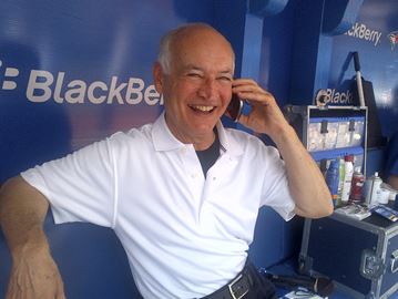 Jays broadcaster Jerry Howarth is either talking baseball on the radio or talking ball on a borrowed cell phone. Photo: Jay Stenhouse Studios.