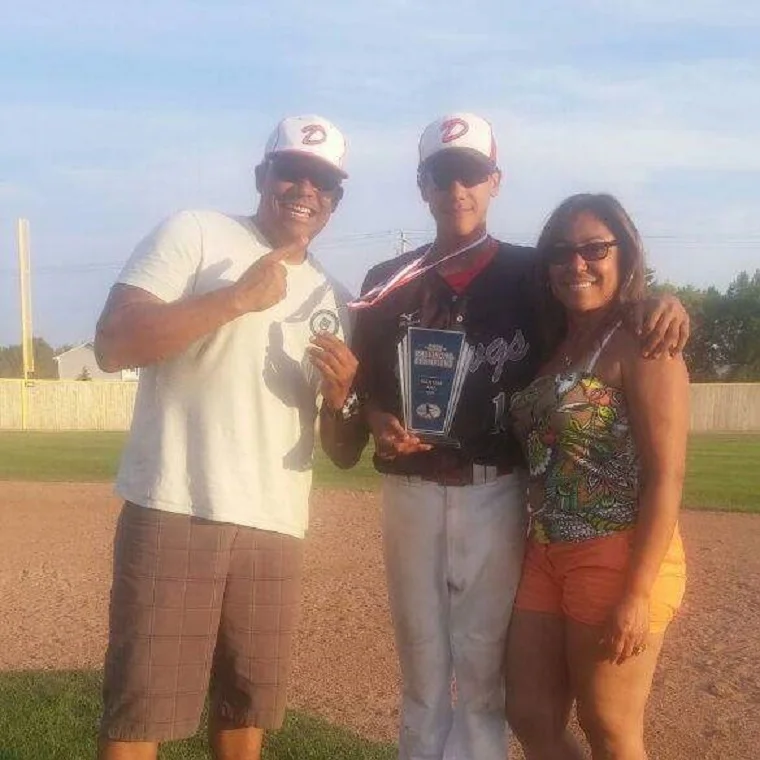 Cesar Valero who came to Canada at age five from Venezuela, flanked by his father, also named Cesar and his mother, Maria Sanchez,