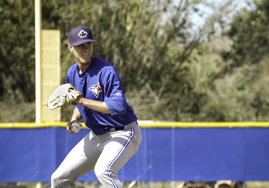 Toronto Blue Jays RHP Jonathan Harris gets set to fire a ground ball to first base during pitcher’s fielding drills spring training in Dunedin, Florida. Photo: Braydon Holmyard. 