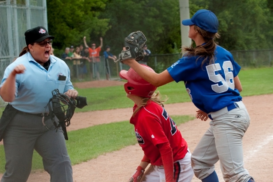 Lisa Turbitt (Milton, Ont.) rings up a runner on a close play at the plate. 