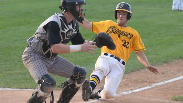 Travis Wacker (Oakville, Ont.) playing summer ball with the Willmar Stingers slides home ...